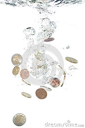 Euro coins falling into the water Stock Photo