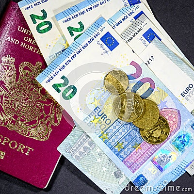 Euro Currency Bank Notes and Coins With a British Passport Editorial Stock Photo