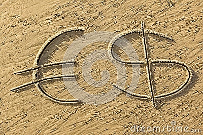Euro and dollar symbol drawn in the sand Stock Photo
