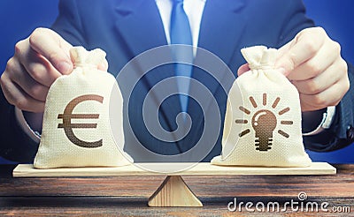 Euro money bag and ideas patents. Buying a startup. Invest in promising companies, technologies. Educational grants. Brain drain. Stock Photo