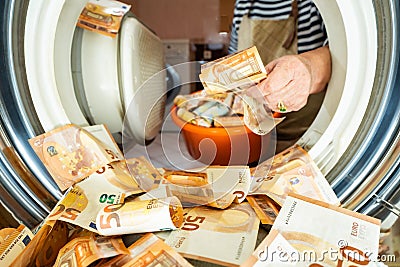 Euro money banknotes in a washing machine, closeup inside view. Stock Photo