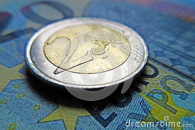Euro money - 2 Euro coin on a banknote Stock Photo