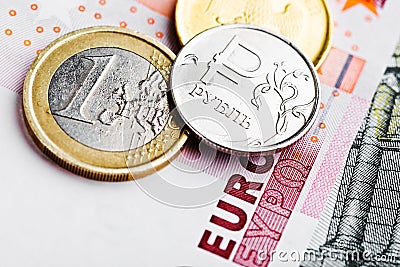 Euro and ruble coins on euro banknotes Stock Photo