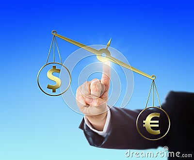 Euro Sign Outweighing The Dollar On A Balance Stock Photo