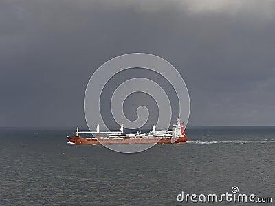 The Eurogracht Cargo Vessel transiting through the Channel with various Luxury Motor Yachts. Editorial Stock Photo