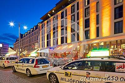 Europe, Scandinavia, Sweden, Gothenburg, Taxis on Vallgatan at Dusk Editorial Stock Photo