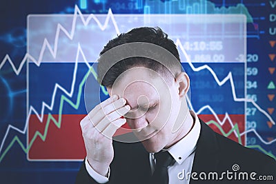 European businessman with declining finance graph Stock Photo