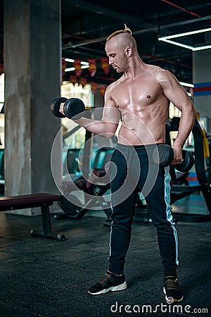 Handsome man make exercise for biceps. Stock Photo