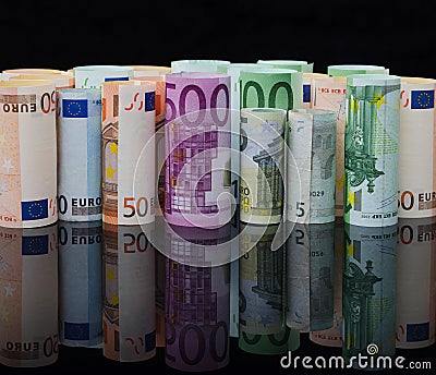 European paper money in rolls on black background with reflection Stock Photo