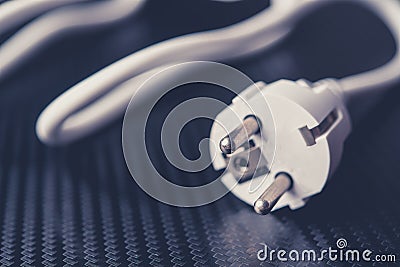 European power cable on carbon background closeup photo. White c Stock Photo