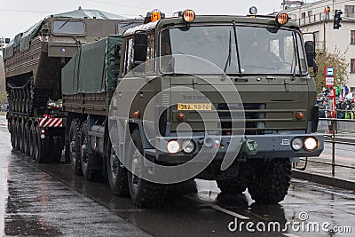 Soldiers of Czech Army are riding military truck with floating transporter Editorial Stock Photo