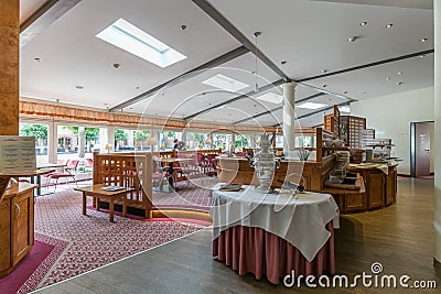 European style retro restaurant with wooden table and chairs Editorial Stock Photo