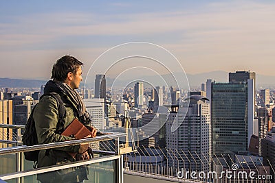 European tourists shooting panoramic view of the city by phone. Editorial Stock Photo