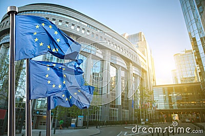 European union flag against parliament in Brussels Stock Photo