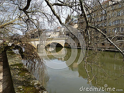 European Winter River Scene with Bridge Editorial Stock Photo