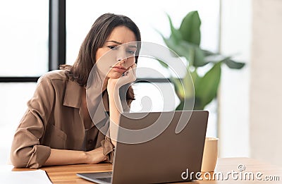 European young manager wants to sleep at work place Stock Photo