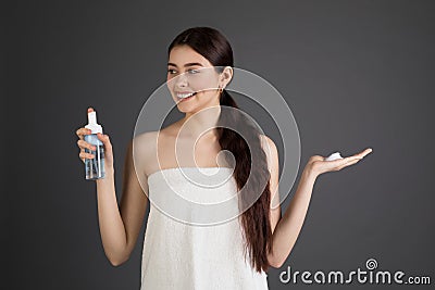 European young smiling woman with perfect skin in bath towel Stock Photo