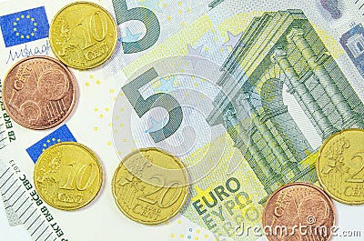 5 euros, 5 euro cents, 10 euro cents, and 20 euro cents. money close up. financial background. quick money Stock Photo