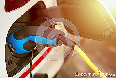 EV or Electric Vehicle Charging Energy From Charging Cable Stock Photo