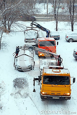 Evacuation of incorrectly parked cars on a winter day. Editorial Stock Photo