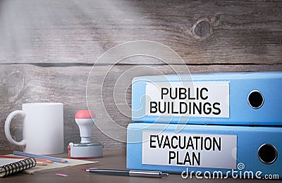 Evacuation plan and public buildings. Two binders on desk in the office Stock Photo
