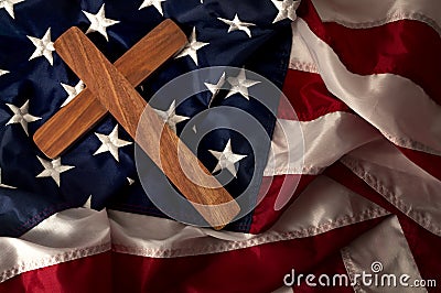 Evangelical America, christianity, born again christian and fundamentalist religious right concept with close up on a wooden cross Stock Photo