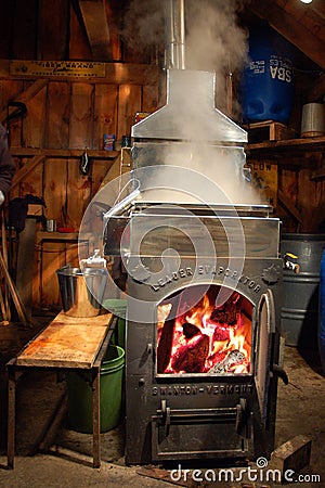 An evaporator heating up to make maple syrup Editorial Stock Photo