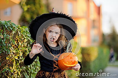 Eve of All Saints' Day. Girl 8-9 years portrays the evil enchantress. Stock Photo