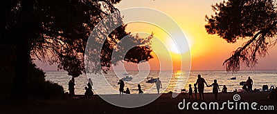 On the evening beach resting people. Sunset. Editorial Stock Photo