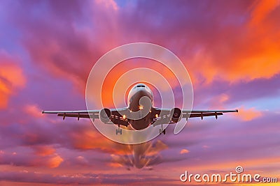 Evening beautiful bright sky at sunset with a flying passenger plane Stock Photo