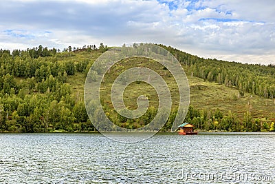 evening on the beautiful Ural lake Teren Kul against the background of the Ilmensky ridge. Stock Photo