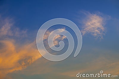 Evening cloudscape with orange tint Stock Photo