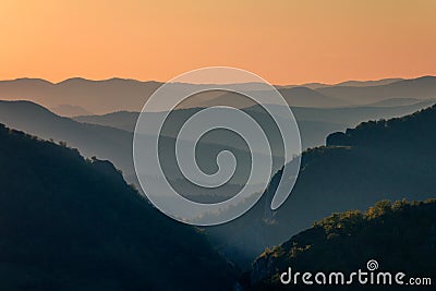 Evening colored view of horizons over the valleys. Stock Photo