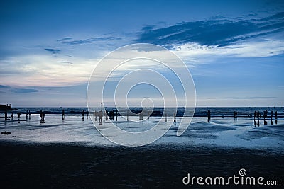 Evening cool look of Murudeshwara beach with dark blue sky and clouds rolling over the sea. Stock Photo