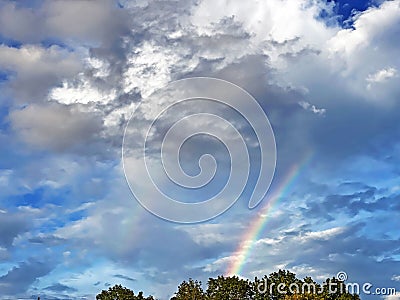 An evening double rainbow between the clouds after a summer downpour, Brienz - Canton of Bern, Switzerland Kanton Bern, Schweiz Stock Photo