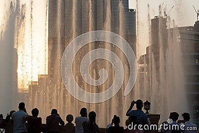 The evening Dubai Fountain show with audience taking photographs Editorial Stock Photo