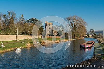 Evening falls over the Church of St. Cyr, Stonehouse and the Stroudwater Canal. Near Stroud Editorial Stock Photo
