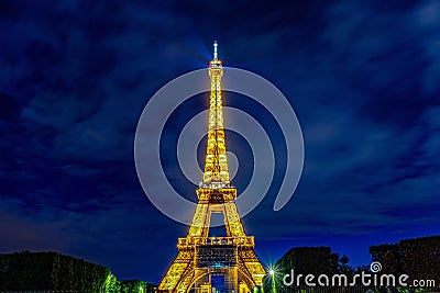 Evening illumination of the Eiffel Tower in Paris Editorial Stock Photo