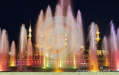 The evening illumination of fountain and Blue mosque with mahya lights during Ramadan, Istanbul Editorial Stock Photo