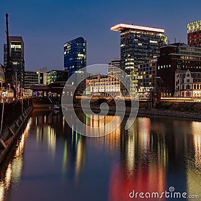 Evening image during blue hour of the Medienhafen in DÃ¼sseldorf Editorial Stock Photo