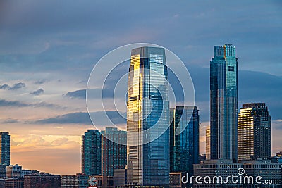 Evening image of the skyline of Jersey City in the state of New Jersey Stock Photo