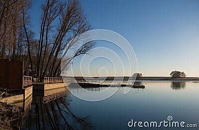 Evening on a lake jetty Stock Photo