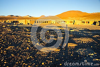 Evening landscape and accomodation buldings at Laguna Colorada, Altiplano area, Bolivia, South America Stock Photo