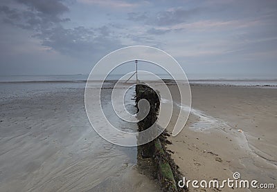 Evening at the Beach with flat sands and Autumn skies Stock Photo
