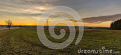 Evening scene of autumn field after sunset Stock Photo