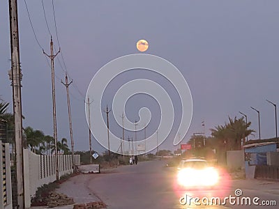 Dusky Road Horizon, with Full Moon in Sky. Stock Photo