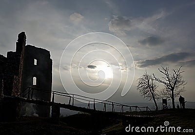 Evening silhouette of bridge and ruins of Oponice fortress, Slovakia Stock Photo