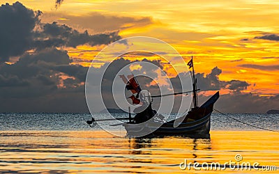 EVENING SKY AND FISHERMAN BOAT Stock Photo