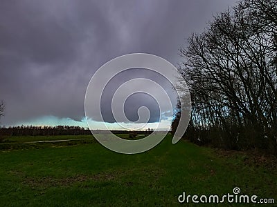 evening sky over the fields overcast with thunderclouds sunset Stock Photo