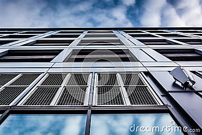 Evening sky reflections on the side of a modern building in Baltimore, Maryland. Stock Photo